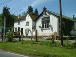 The Chequers Inn is a former early C17th cottage which became a pub in1798. the extension in corrugated iron is an eccentric addition